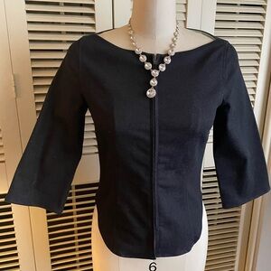 Translatio dark denim jacket or top.